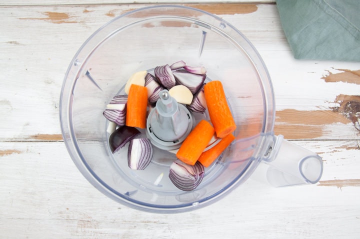 onions, garlic and carrots in a food processor