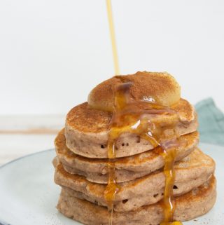 stacked vegan applesauce pancakes with maple syrup