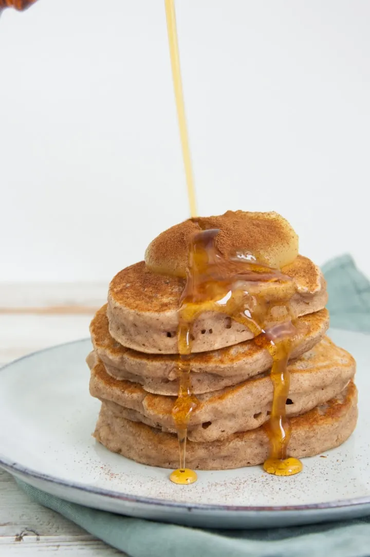stacked vegan applesauce pancakes with maple syrup