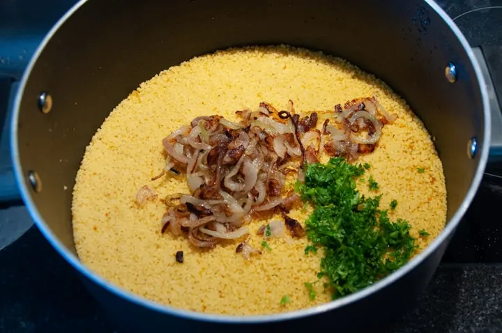 couscous, onions and parsley in a pot