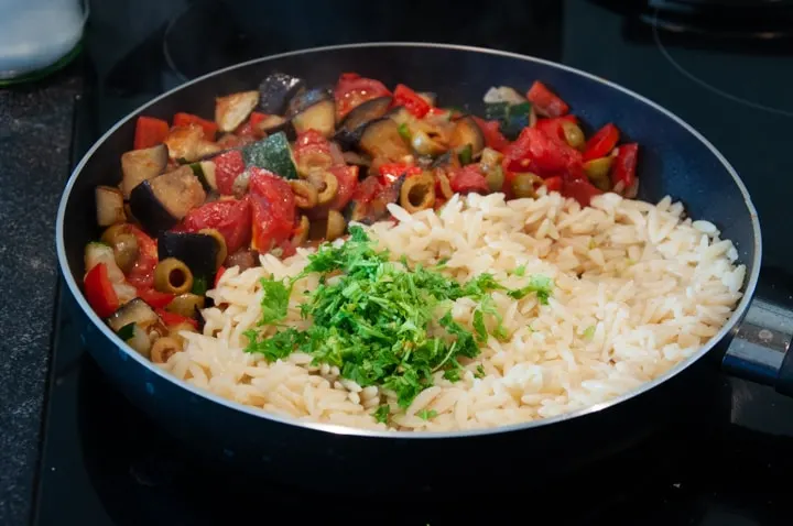 orzo pasta and veggies in a pan