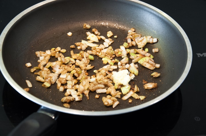onions and ginger in pan