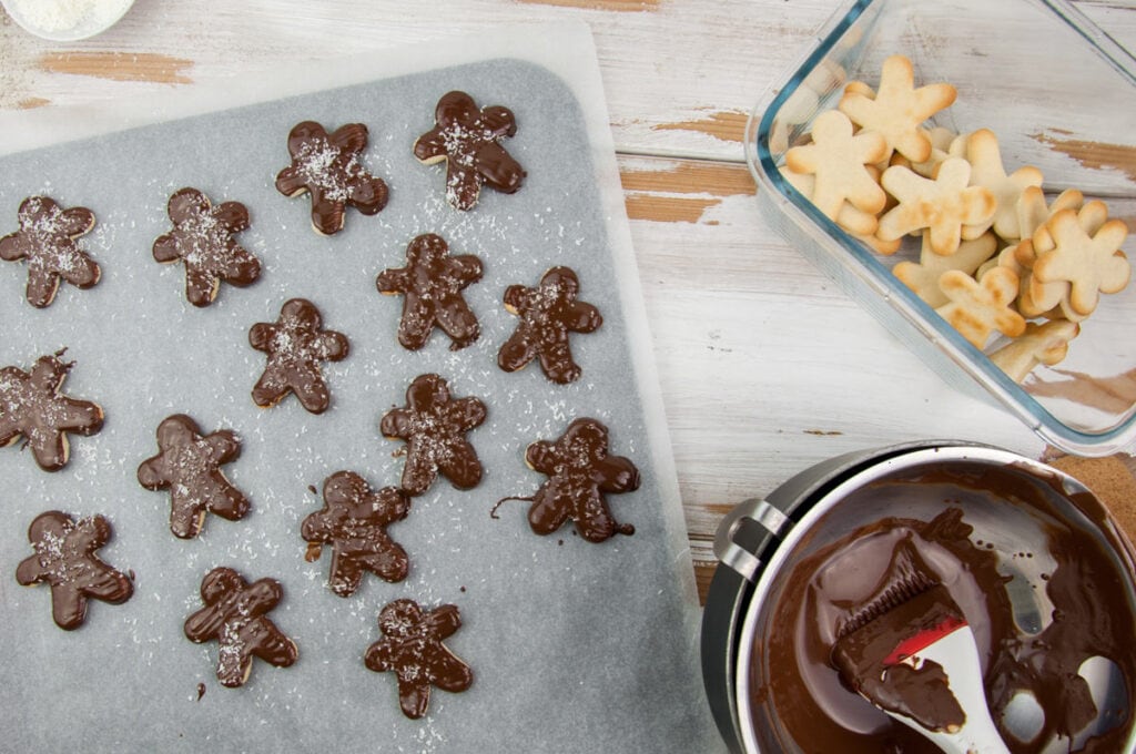 almond butter sugar cookies with chocolate coating and shredded coconut