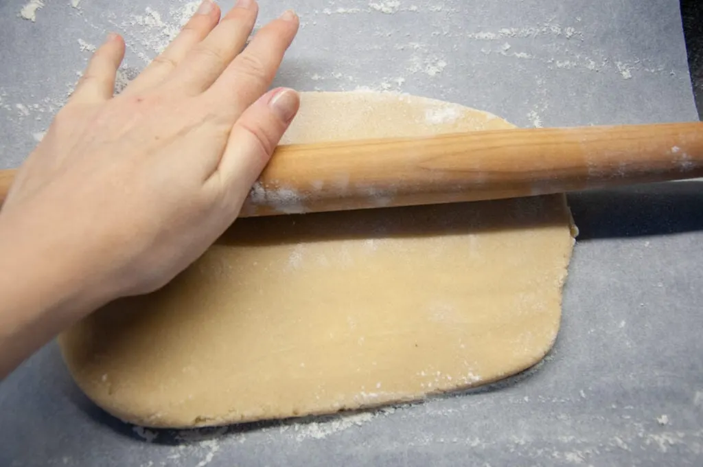 rolling out the almond butter sugar cookie dough