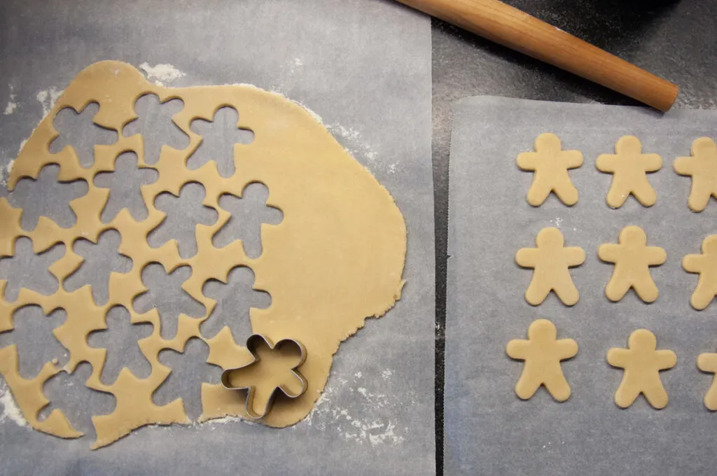 cutting out almond sugar cookies