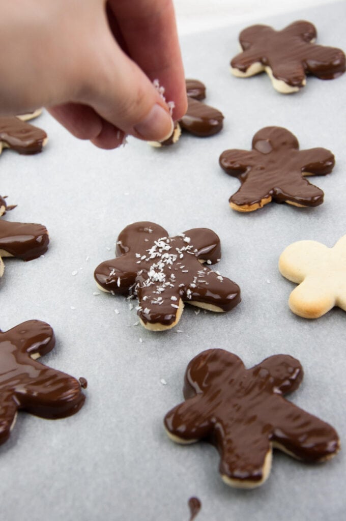 almond butter sugar cookies with chocolate coating and shredded coconut