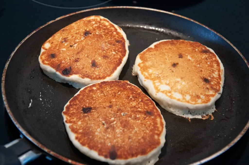 chocolate chip pancakes in pan