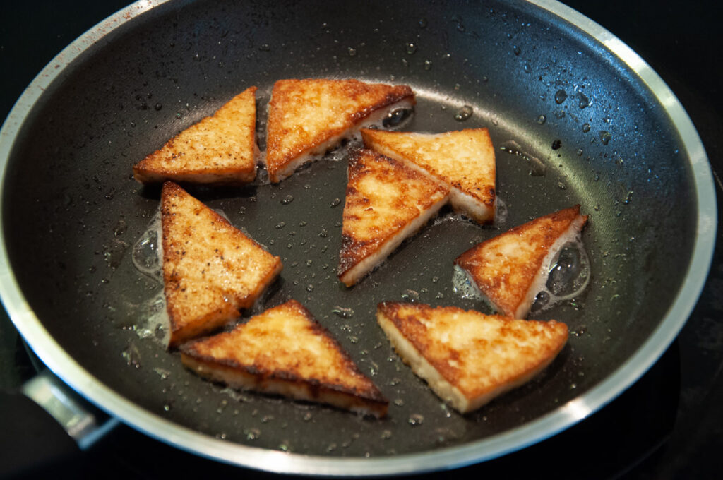 brown tofu in pan