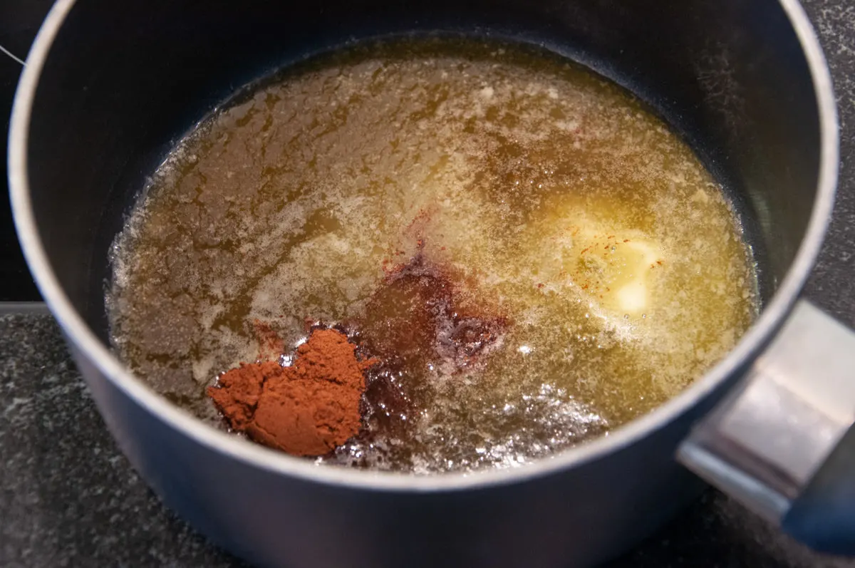 salted butter, maple syrup and cinnamon in pot