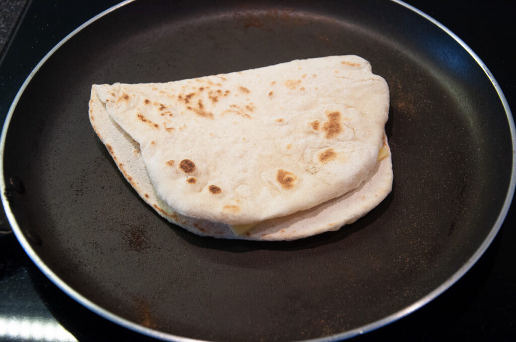 folded naan in a pan