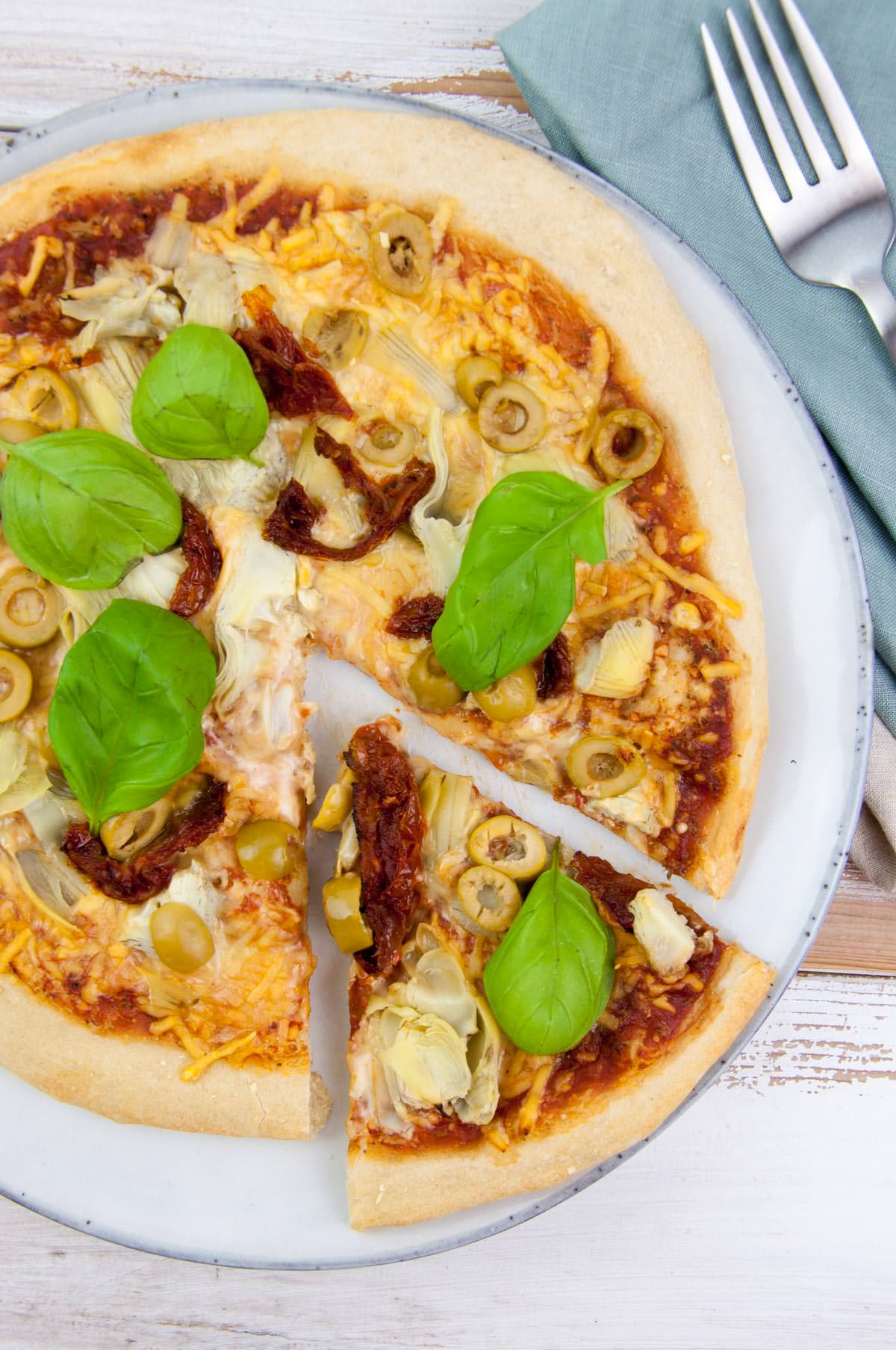 antipasti pizza with olives, artichokes, and sun-dried tomatoes