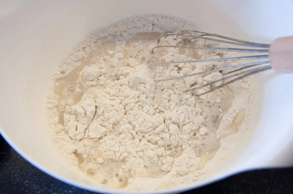 flour, water, and salt in bowl