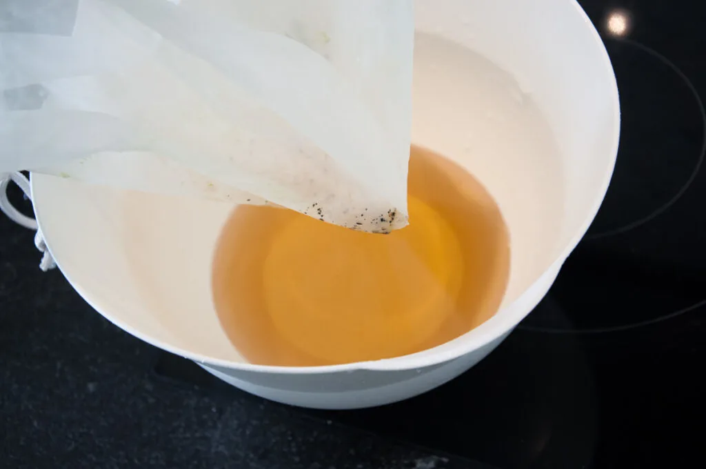 straining vanilla syrup
