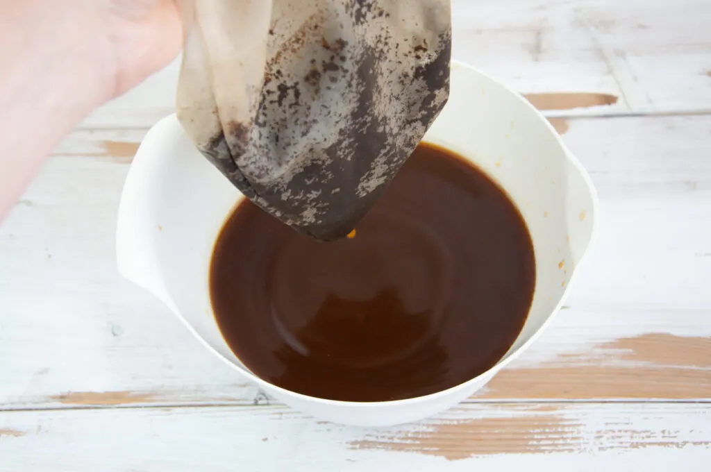 pouring coffee in nut milk bag