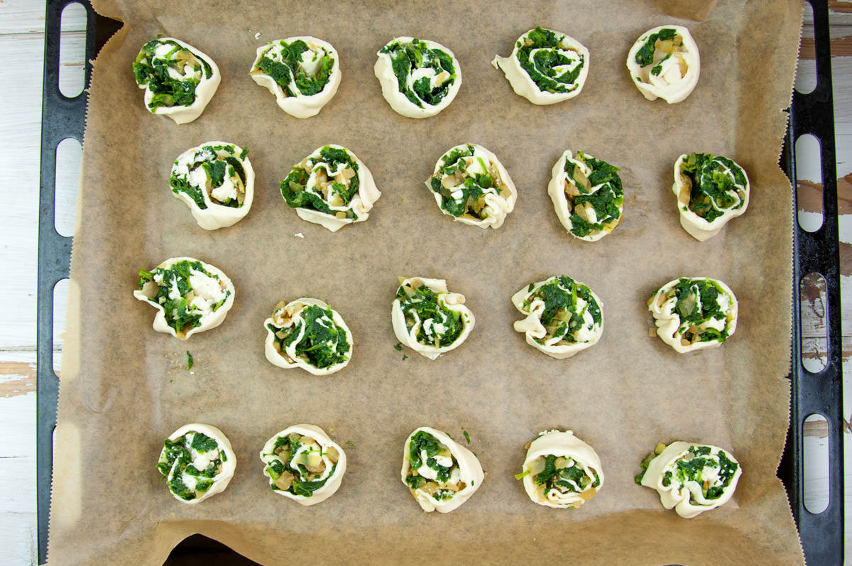 Vegan Spinach Pinwheels on a baking tray before baking