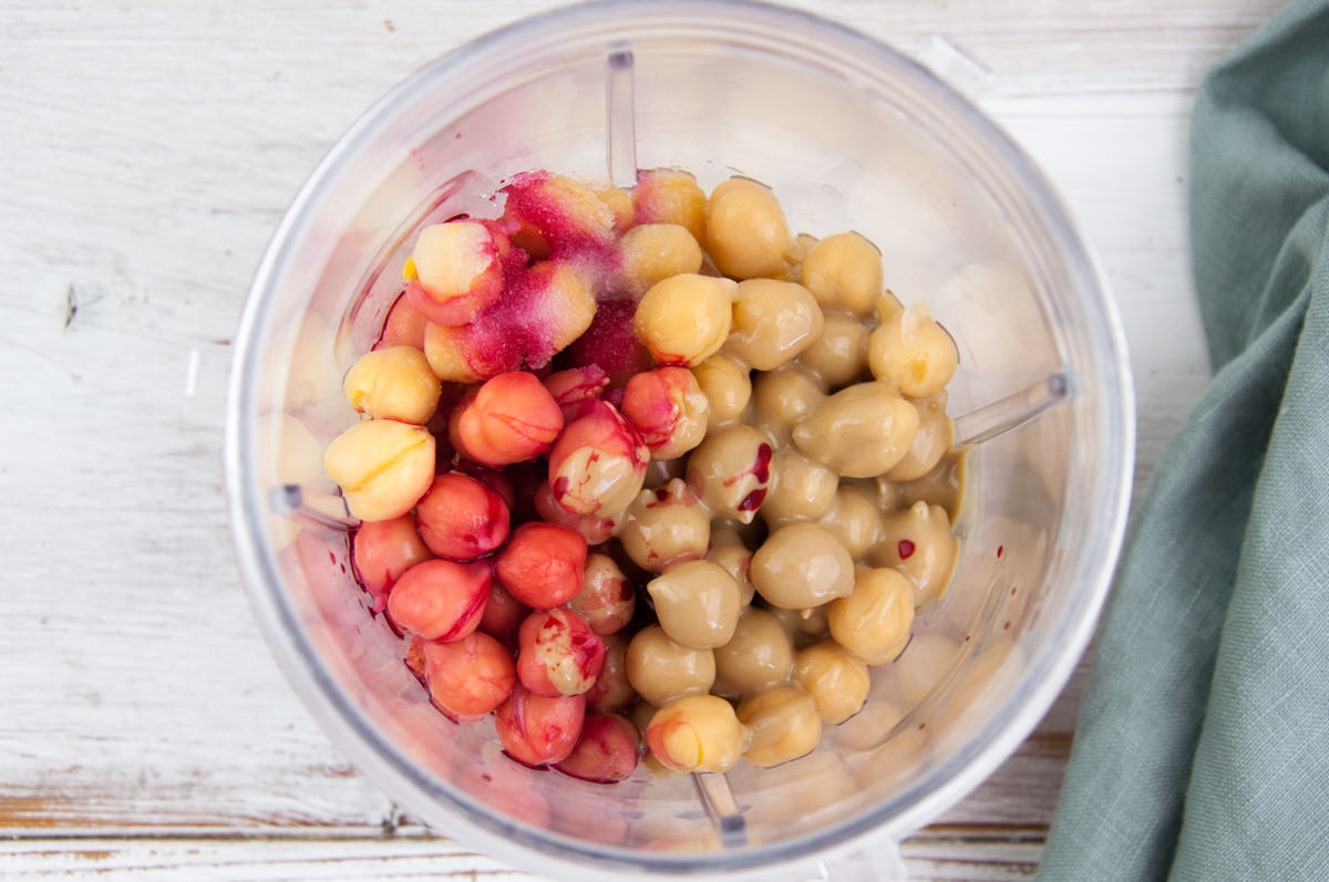 chickpeas, tahin, lemon juice, red beet juice in blender