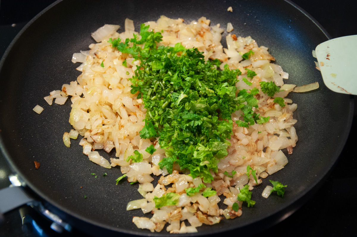 onion, garlic and parsley in a pan
