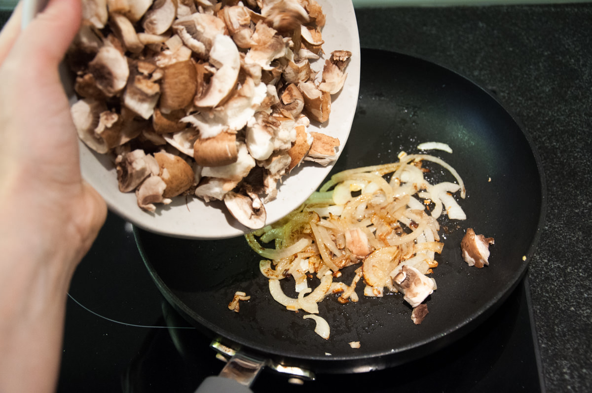 mushrooms in pan with onion