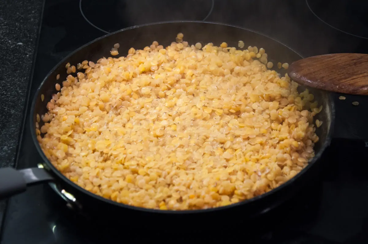 cooked red lentils in pan