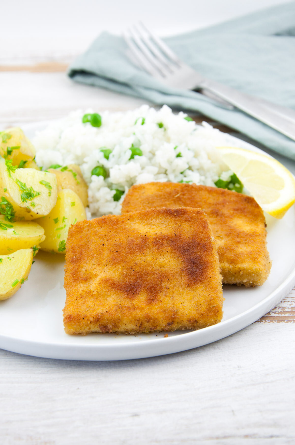 Tofu Schnitzel served with rice+peas and buttered parsley potatoes