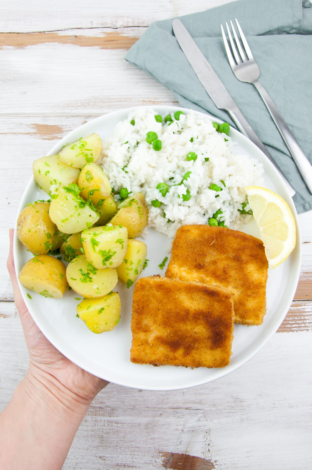 Tofu Schnitzel served with rice+peas and buttered parsley potatoes