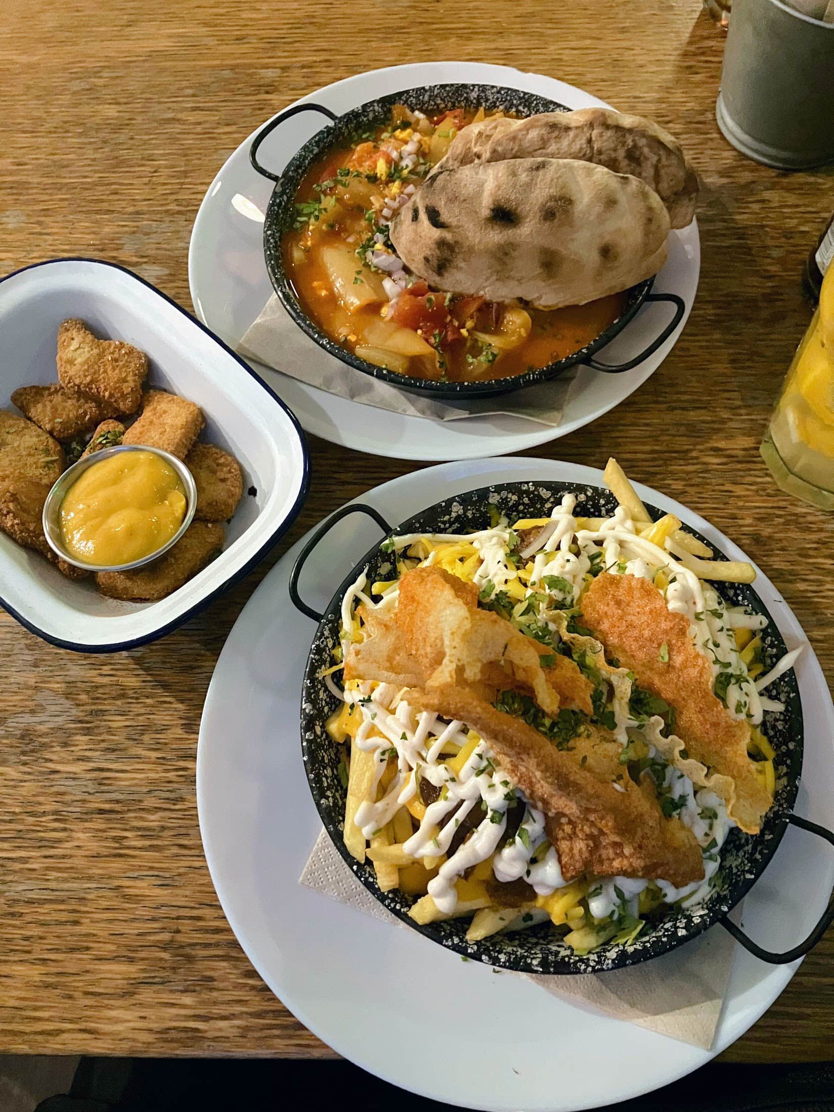 Vegan dishes with bread, soup, and pasta at Elephantastic Vegan restaurant.